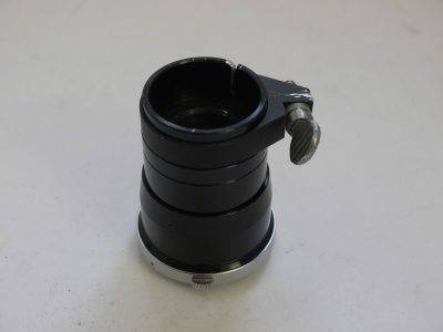 Unamed Pen F Tube, rotating, with end clamp. Fits onto Pen F/FT camera body (probable part of accessory device. Appearance the same as other Penf Accessories/lenses, so probably Olympus made