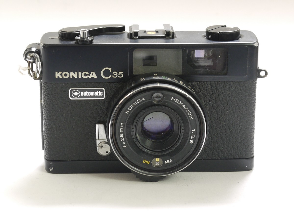 Konica C35 automatic 35mm coupled rangefinder camera with 38mm f2 Konica C35 automatic 35mm coupled rangefinder camera with 38mm f2.8 Hexanon lens, wrist stap, pouch case, guarantee card & box