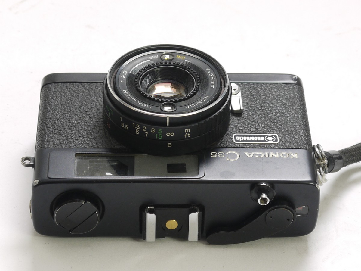 Konica C35 automatic 35mm coupled rangefinder camera with 38mm f2 Konica C35 automatic 35mm coupled rangefinder camera with 38mm f2.8 Hexanon lens, wrist stap, pouch case, guarantee card & box