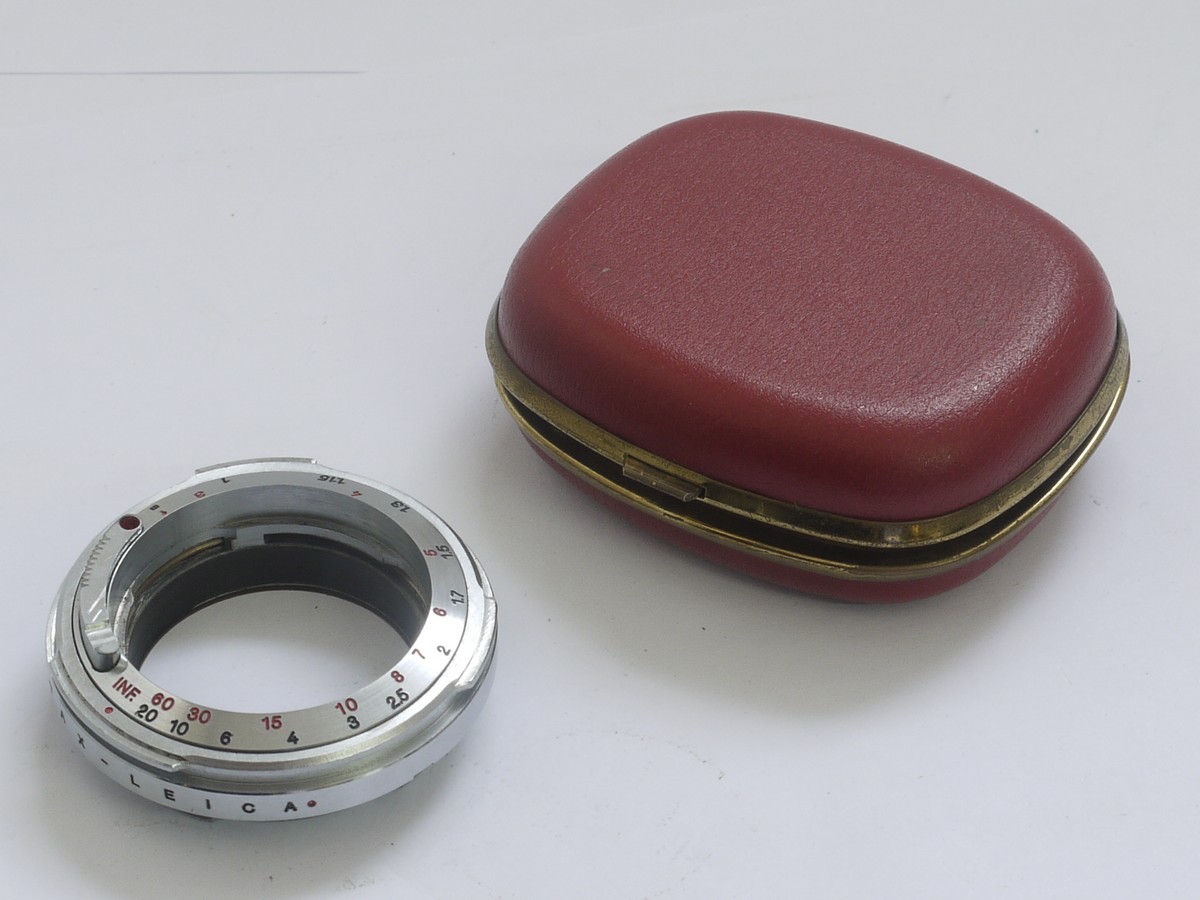 Unamed, high quality made Contax lens to Leica M mount adapter, chrome, 6-bit, with rangefinder coupling helicoid. Scale in meters & feet Unamed, high quality made Contax lens to Leica M mount adapter, chrome, 6-bit, with rangefinder coupling helicoid. Scale in meters & feet. Has internal & External mount for all Contax & Nikob S rangefinder lenses