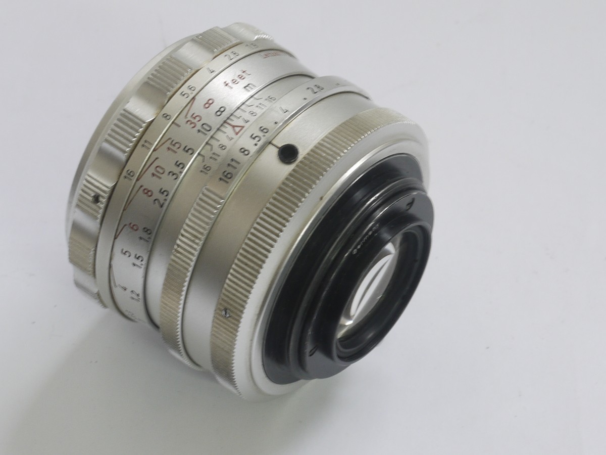 mwclassiccameras-20210409-453 Steinheil 55mm f1.9 Quinon chrome manual focus M42 screw mount lens + makers caps. UNCOMMON