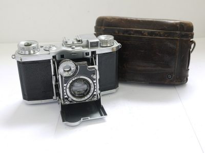 Zeiss Ikon Super Nettel 35mm folding coupled rangefinder camera, chrome, with 5cm f2.8 Tessar lens + makers ER case. UNCOMMON CHROME VERSION