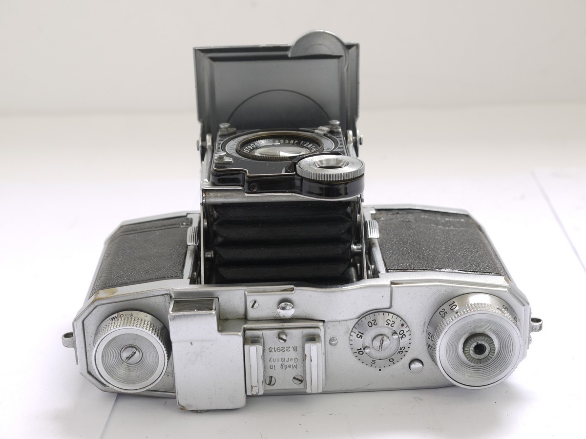 mwclassiccameras-20210430-58 Zeiss Ikon Super Nettel 35mm folding coupled rangefinder camera, chrome, with 5cm f2.8 Tessar lens + makers ER case. UNCOMMON CHROME VERSION
