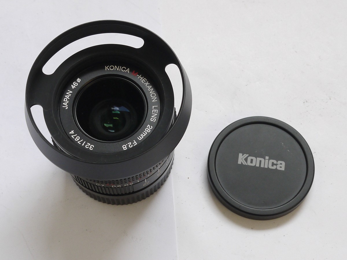 mwclassiccameras-20210513-253 Konica 28mm f2.8 M-Hexanon black Leica M mount lens + matching 46mm screw-in metal lens hood with vents (vent position is adjustable) & makers caps