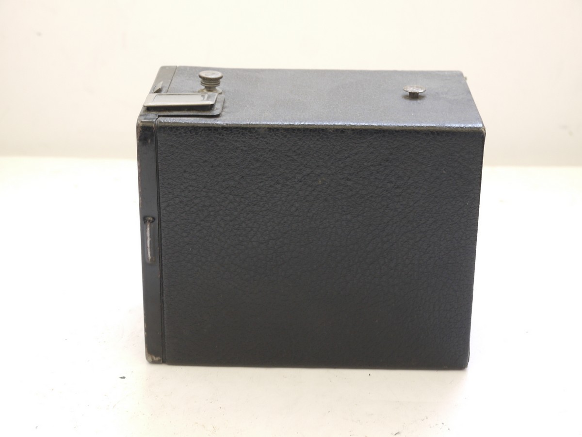 mwclassiccameras-20210716-323 Kodak Six-20 Brownie Junior leatherette covered Box camera with metallic Art-Deco patterned front c1934-42. No handle