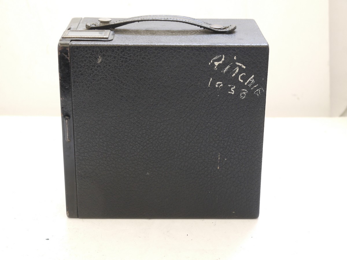 mwclassiccameras-20210716-335 Kodak Six-16 Brownie Junior cardboard Box camera with metallic Art-Deco patterned front c1934-42. With handle