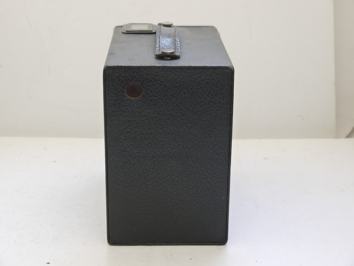 mwclassiccameras-20210716-336 Kodak Six-16 Brownie Junior cardboard Box camera with metallic Art-Deco patterned front c1934-42. With handle