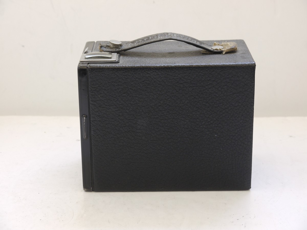 mwclassiccameras-20210716-343 Kodak Target Brownie Six-20 leatherette covered Box camera with metallic Art-Deco patterned front c1941-46. With handle