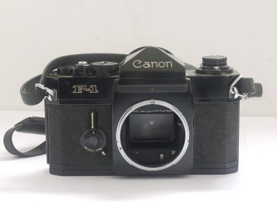 Canon F-1 35mm SLR body with plain. Non-metering prism finder, rubber eyecup & makers neck strap