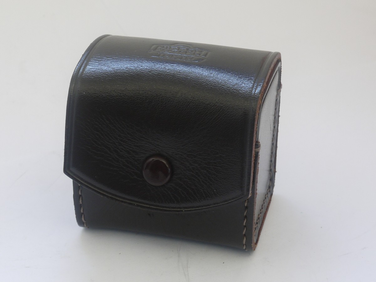 mwclassiccameras-20210917-325 Nikon Nippon Kogaku Tokyo brown leather case for small lens/accessory (65 x 63 x 52mm)