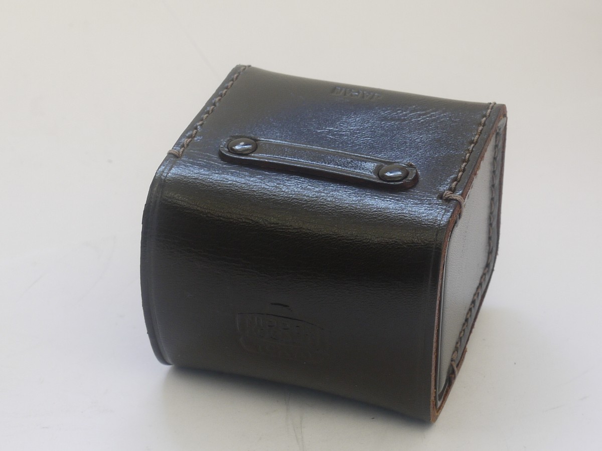mwclassiccameras-20210917-328 Nikon Nippon Kogaku Tokyo brown leather case for small lens/accessory (65 x 63 x 52mm)
