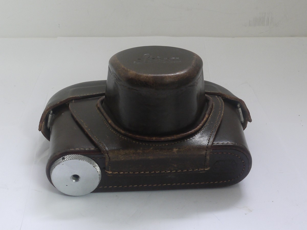 mwclassiccameras-20211008-90 Leitz brown leather ER case with strap for the M3 with long nose front & small triod screw. Early type with single button fastening