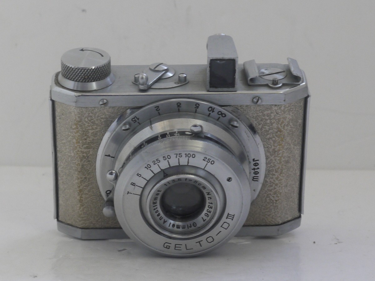 mwclassiccameras-20211112-37 Silver Gelto DIII 127 rigid body all metal camera with textured patterning, with 5cm f3.5 Grimmel extending lens.