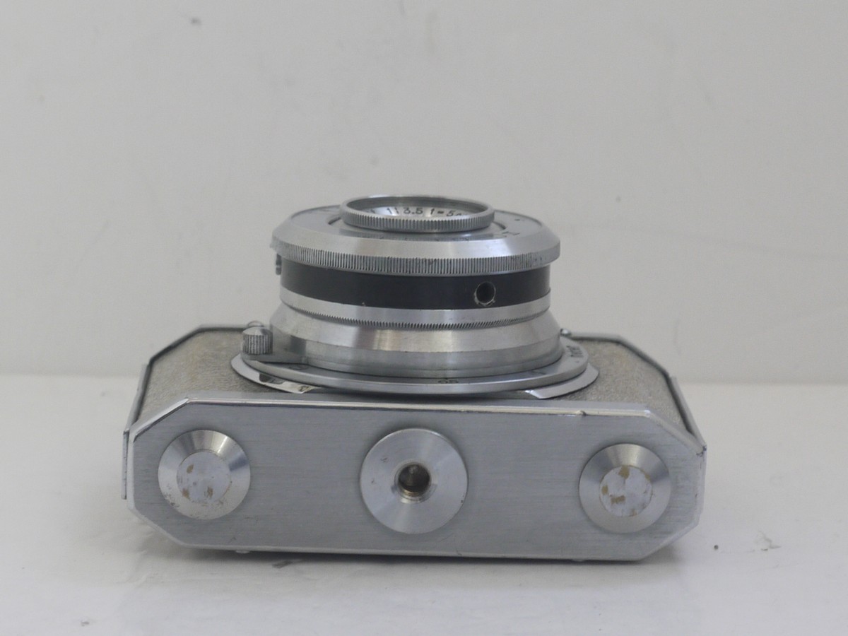 mwclassiccameras-20211112-40 Silver Gelto DIII 127 rigid body all metal camera with textured patterning, with 5cm f3.5 Grimmel extending lens.