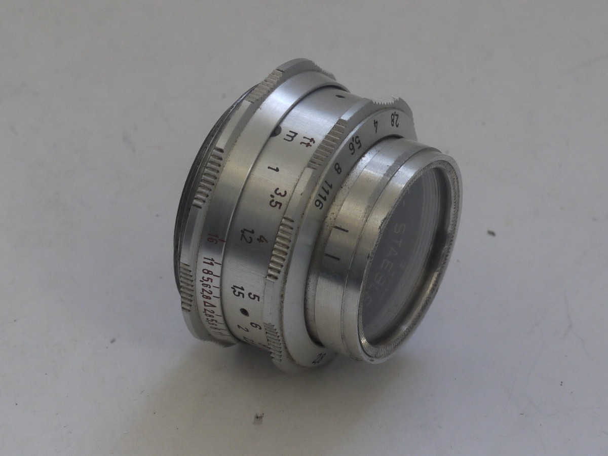 mwclassiccameras-20211112-87 Braun Paxette 35mm coupled rangefinder camera with three built-in frame finders + Steinheil 50mm f2.8 Cassarit E, Staeble 45mm f2.8 Kata & Staeble 135mm f3.8 Telenon L39 screw mount lenses, Braun Universal shoe finder, Various size/types filters & makers outfit case