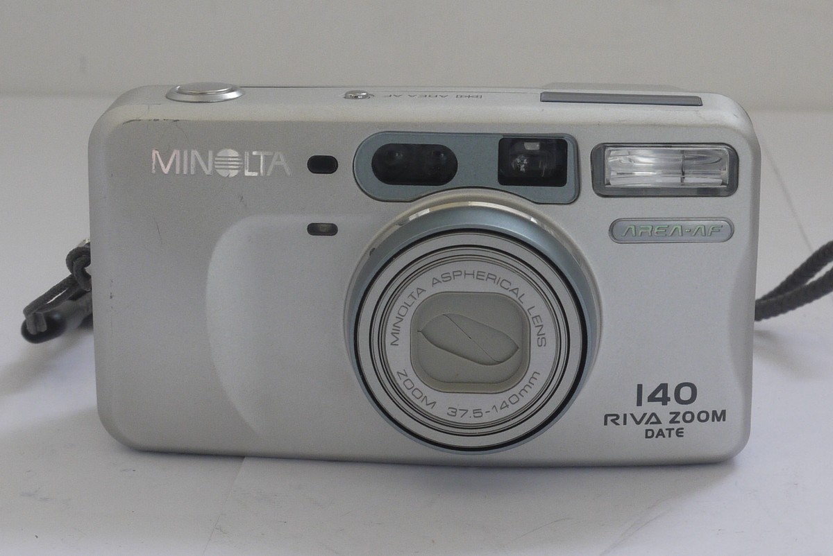 mwclassiccameras-20211119-100 Minolta 140 Riva Zoom Date 35mm compact Autofocus camera, silver grey coloured, with 37.5-140mm zoom + cord strap