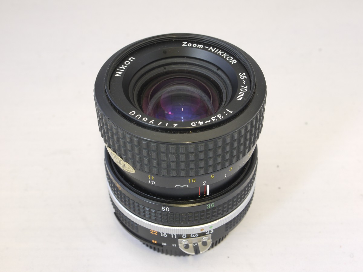 mwclassiccameras-20220325-63 Nikon 35-70mm f3.3-4.5 Zoom Nikkor manual fiocus AIS ount lens + makers caps & Instructions