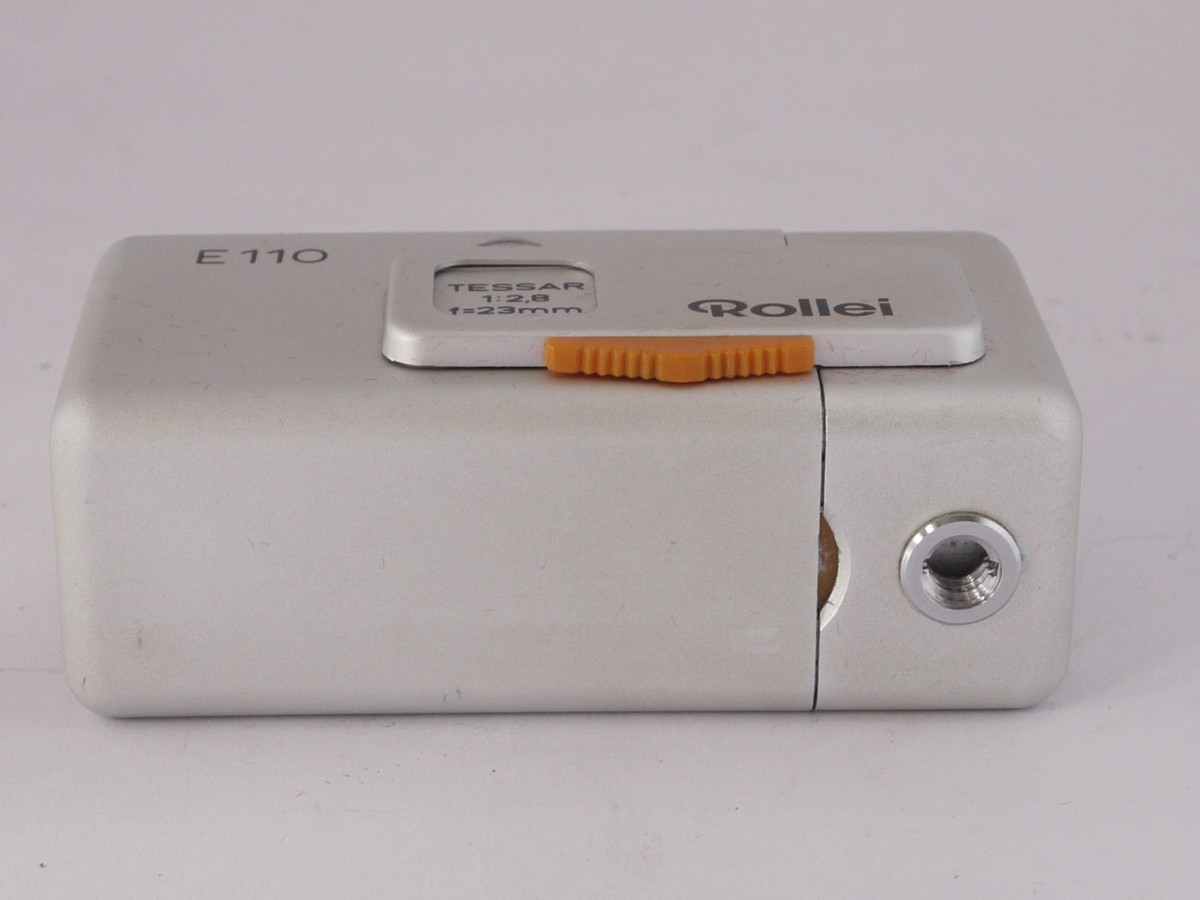 mwclassiccameras-20220408-208 Rollei E110 Silver subminiature (110 film) camera with 23mm f2.8 Tessar lens, with Bulb flash adapter, chaion strap, soft case & presentation case