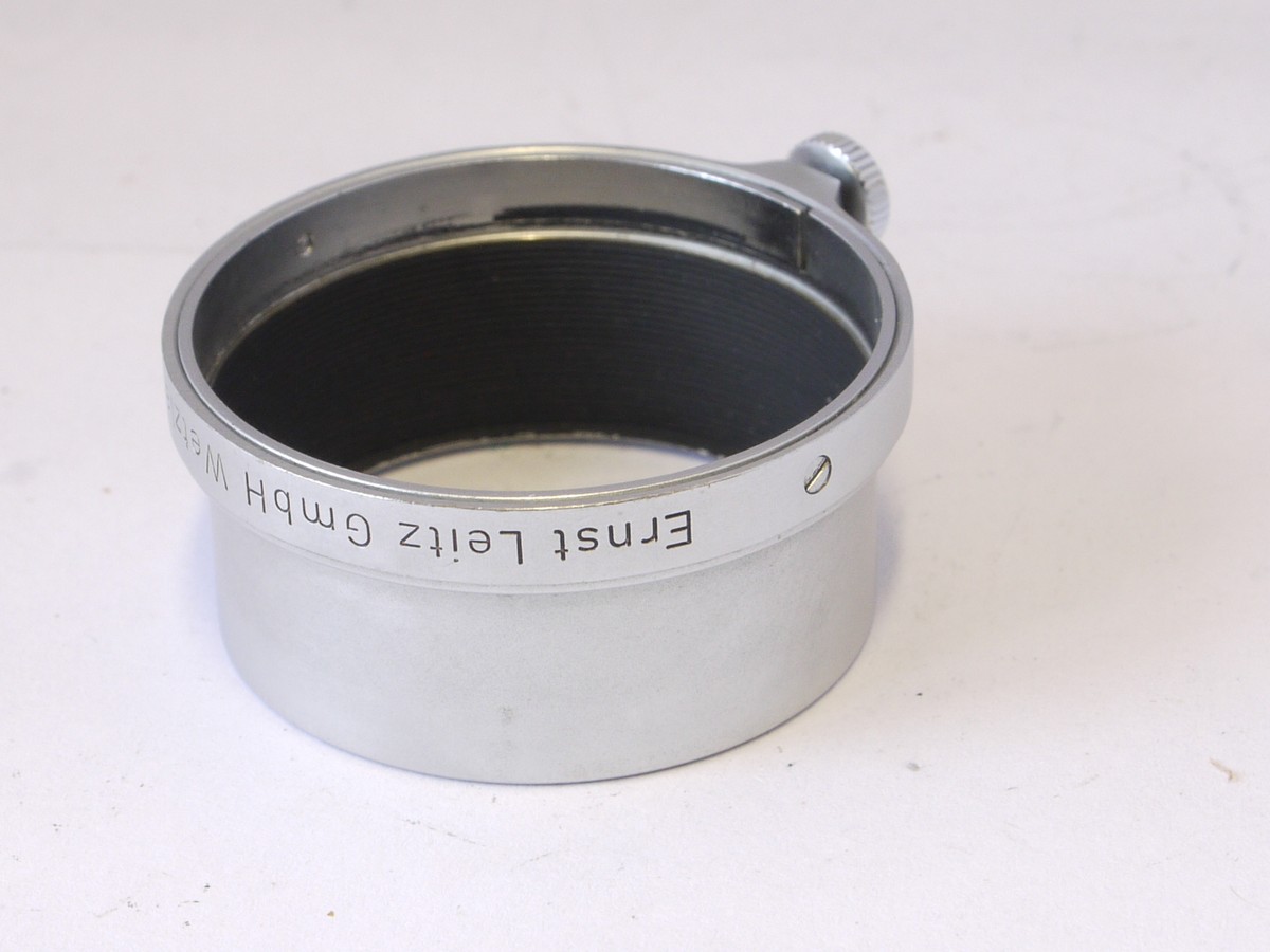 mwclassiccameras-20220408-397 Leitz A36 push-on chrome lens hood, FISON, with fixing screw, for 5cm f3.5 Elmar lens