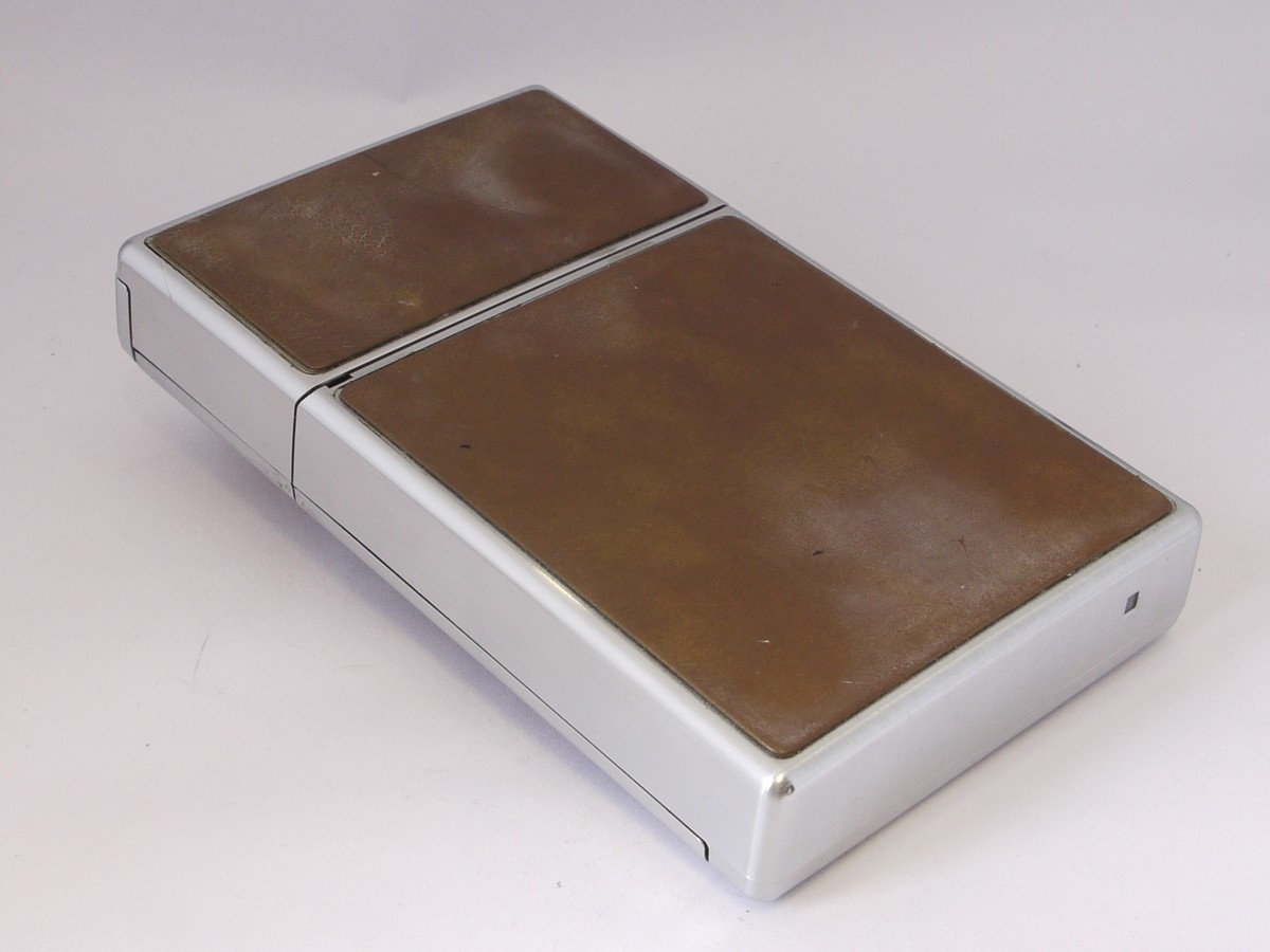 mwclassiccameras-20220513-148 Polaroid SX-70 Alpha 1 camera, chrome with tan leather covering + makers Tan case