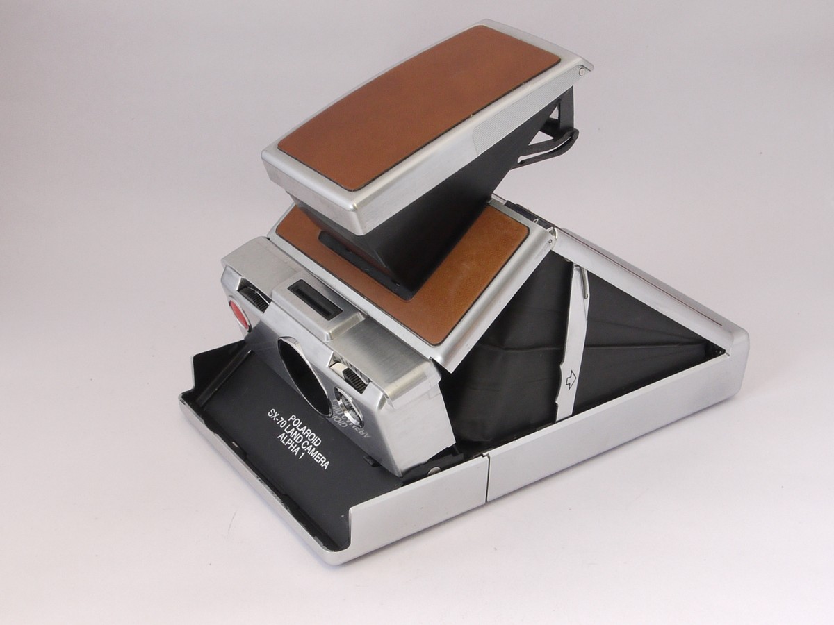 mwclassiccameras-20220513-150 Polaroid SX-70 Alpha 1 camera, chrome with tan leather covering + makers Tan case