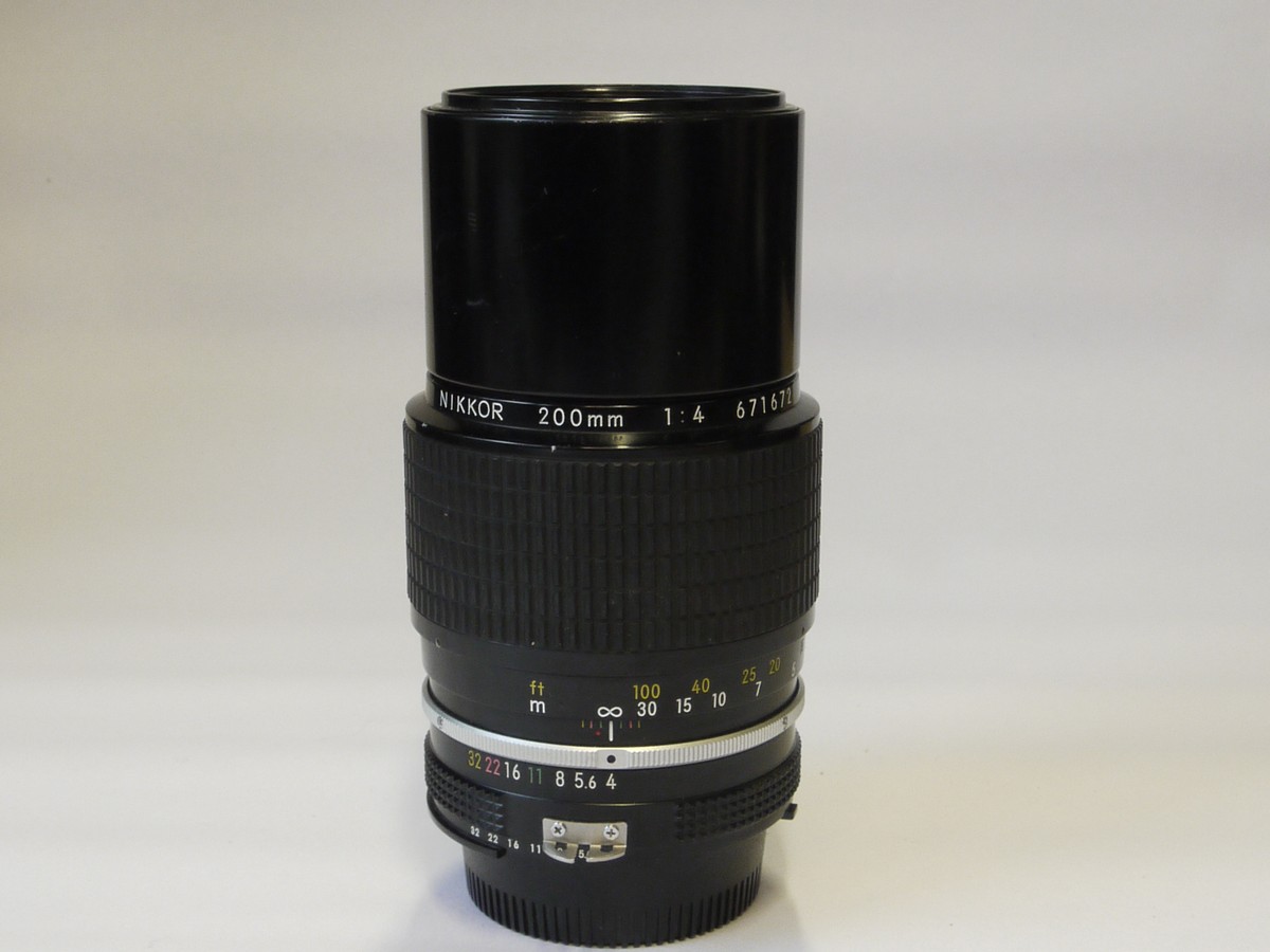 mwclassiccameras-20220520-17 Nikon 200mm f4 Nikkor manual focus AI mount lens with built-in lens hood & caps