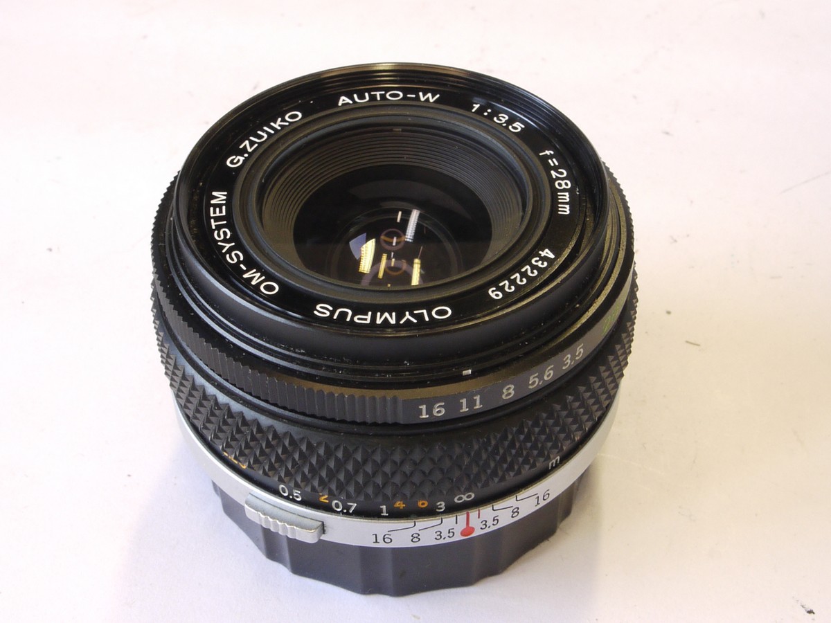 mwclassiccameras-20220603-188 Olympus 28mm f3.5 G Zuiko manual focus OM mount lens + rear cap & filter