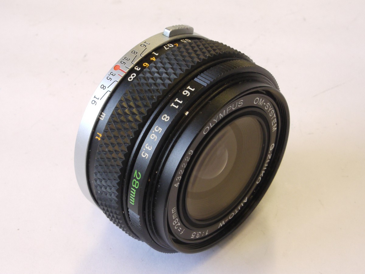 mwclassiccameras-20220603-190 Olympus 28mm f3.5 G Zuiko manual focus OM mount lens + rear cap & filter