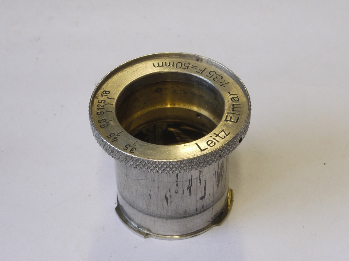 mwclassiccameras-20220610-369 Leitz Spare parts - Leica III/IIIa/IIIb body shell with vulcanite covering & 2 added front body flash sockets + Glass elements for the 50mm f3.5 Elmar nickel lens & the inner barrel & front face with some inner parts & with tIris Diaphragm