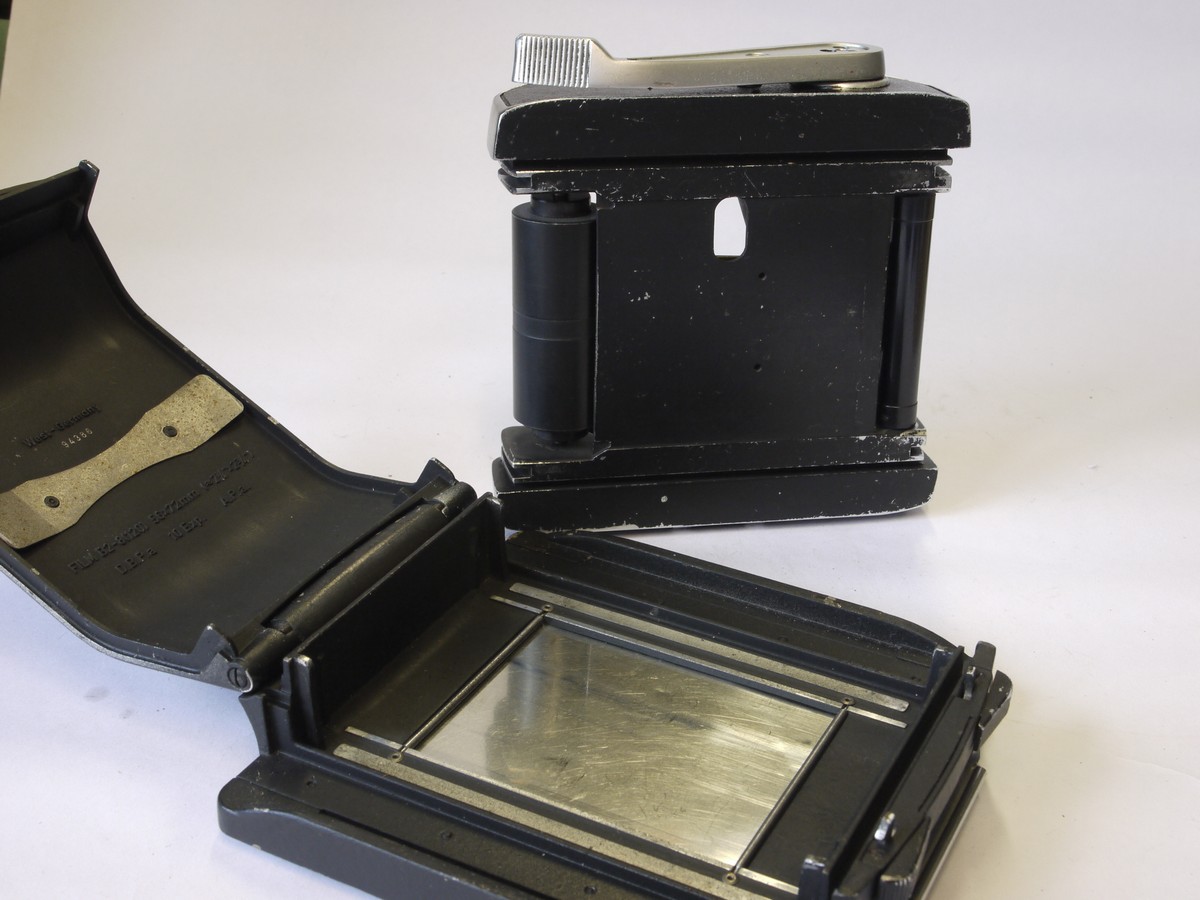 mwclassiccameras-20220617-230 Linhof 6x7 Rotating Rollfilm Back, black covering, with Dark slide. Logo on back
