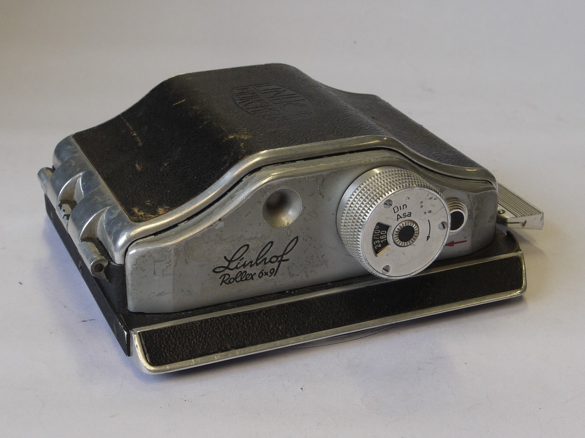 mwclassiccameras-20220708-74 Linhof Rollex 6x9 rotating rollfilm back, for 5x4, black covering, with dark slide. Name embossed on rear covering