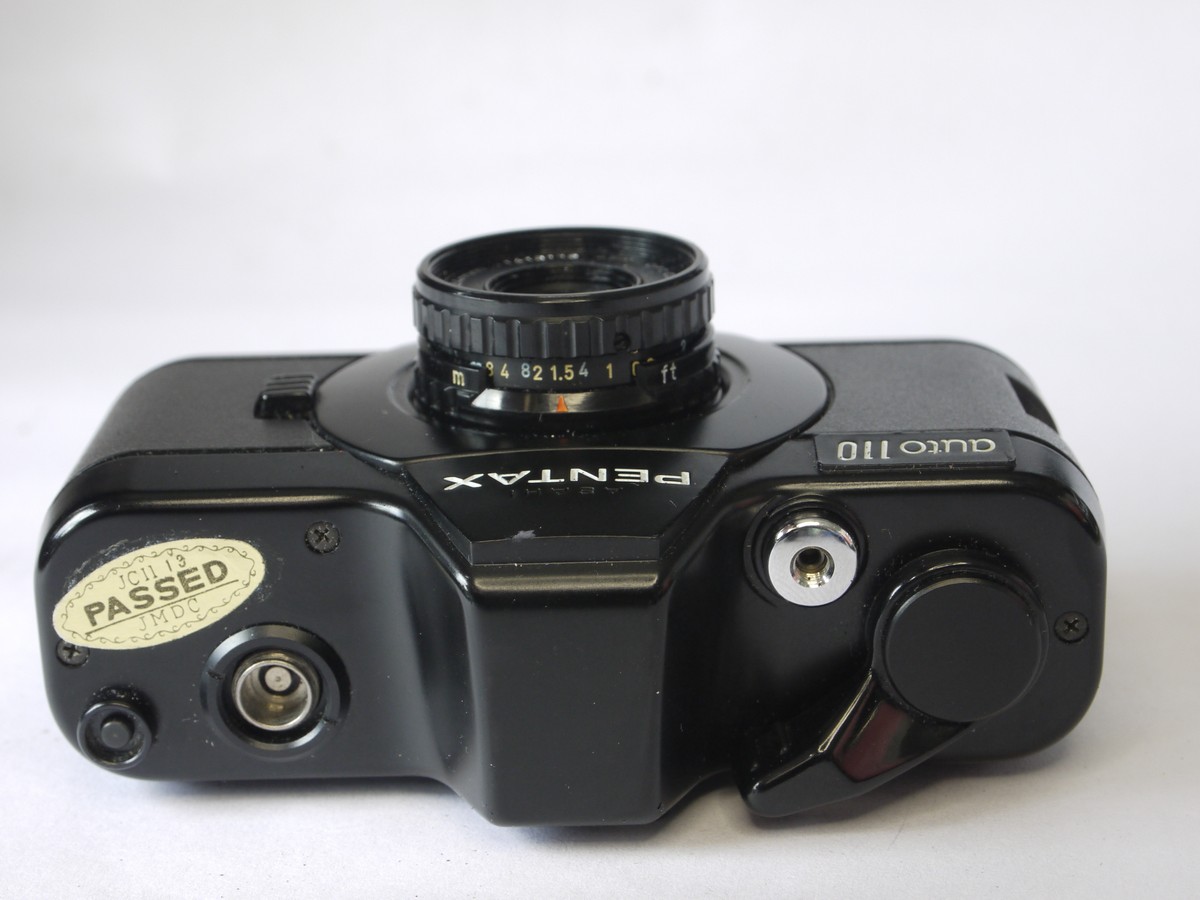 mwclassiccameras-20220729-220 Pentax Auto 110 camera with 24mm f2.8, 18mm f2.8 & 50mm f2.8 interchangeabe lenses (with caps) AF130P flash & makers outfit box