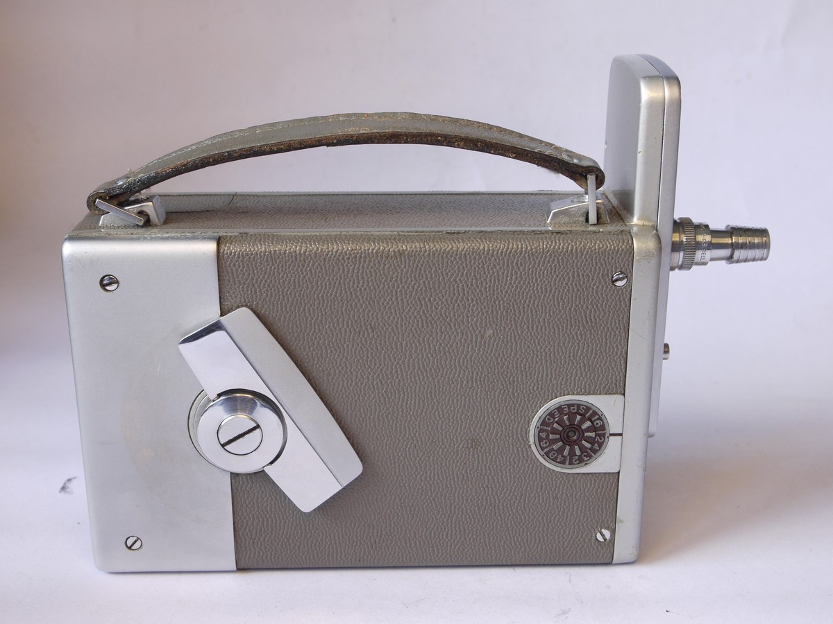 mwclassiccameras-20220805-193 Bell & Howell 16mm Autoload clockwork motorized camera body, twin turret with 1 icnh & 2 inch finders (No lenses). Take autoload 16mm Cartridge film. With leather case & instructions