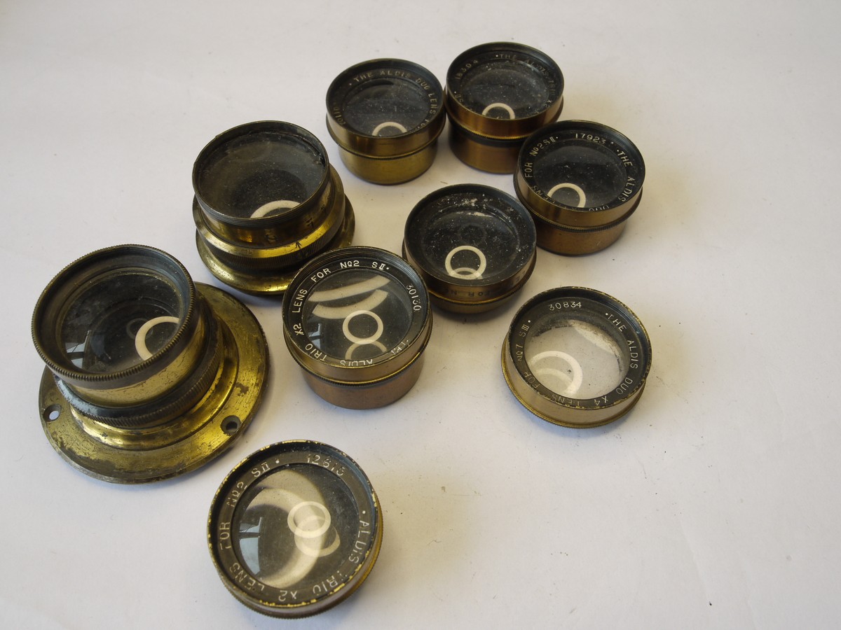 mwclassiccameras-20220812-256 Aldis set of Seven Brass Close-Up Lenses. Four Duo lenses & Three Trio Lenses, six with rar caps