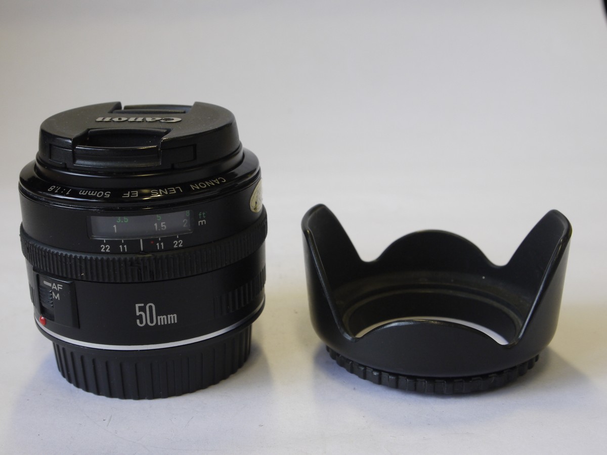 mwclassiccameras-20220819-23 Canon EF 50mm f1.8 Lens + makers caps & independent made DC-S 52mm screw-in lens hood