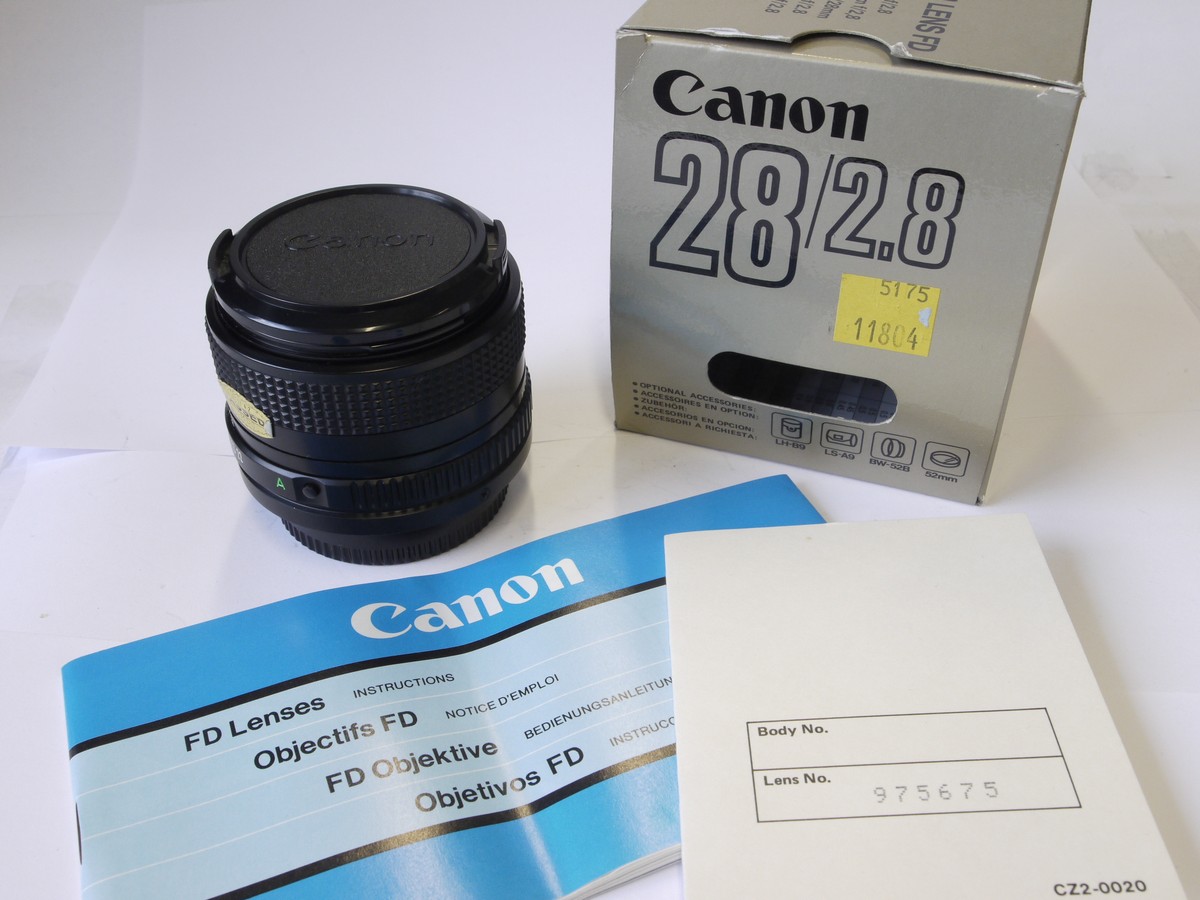 mwclassiccameras-20220930-140 Canon 28mm f2.8 manual focus FD mount lens + makers caps, inspection card, booklet & box with packaging