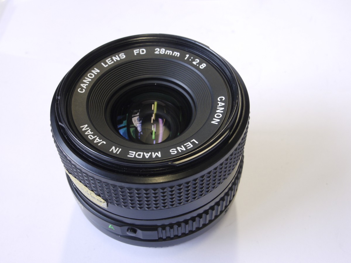 mwclassiccameras-20220930-141 Canon 28mm f2.8 manual focus FD mount lens + makers caps, inspection card, booklet & box with packaging