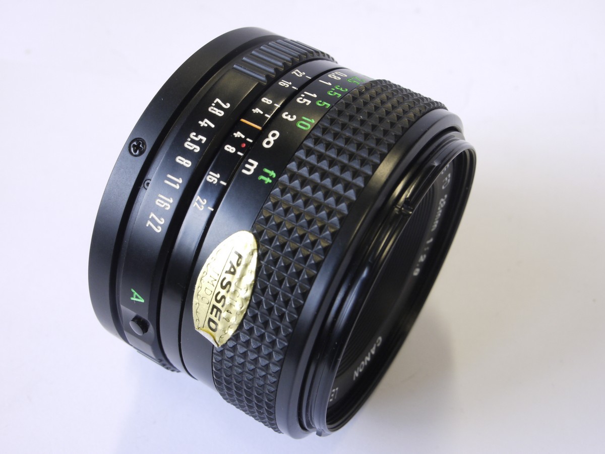 mwclassiccameras-20220930-143 Canon 28mm f2.8 manual focus FD mount lens + makers caps, inspection card, booklet & box with packaging