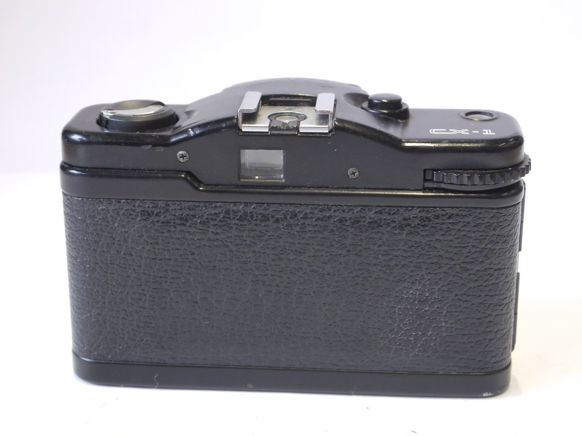 mwclassiccameras-20221007-50 Cosina CX-1 35mm compact zone focus camera with 33mm f3.5 Cosinon lens. Unique trist/lock front cover