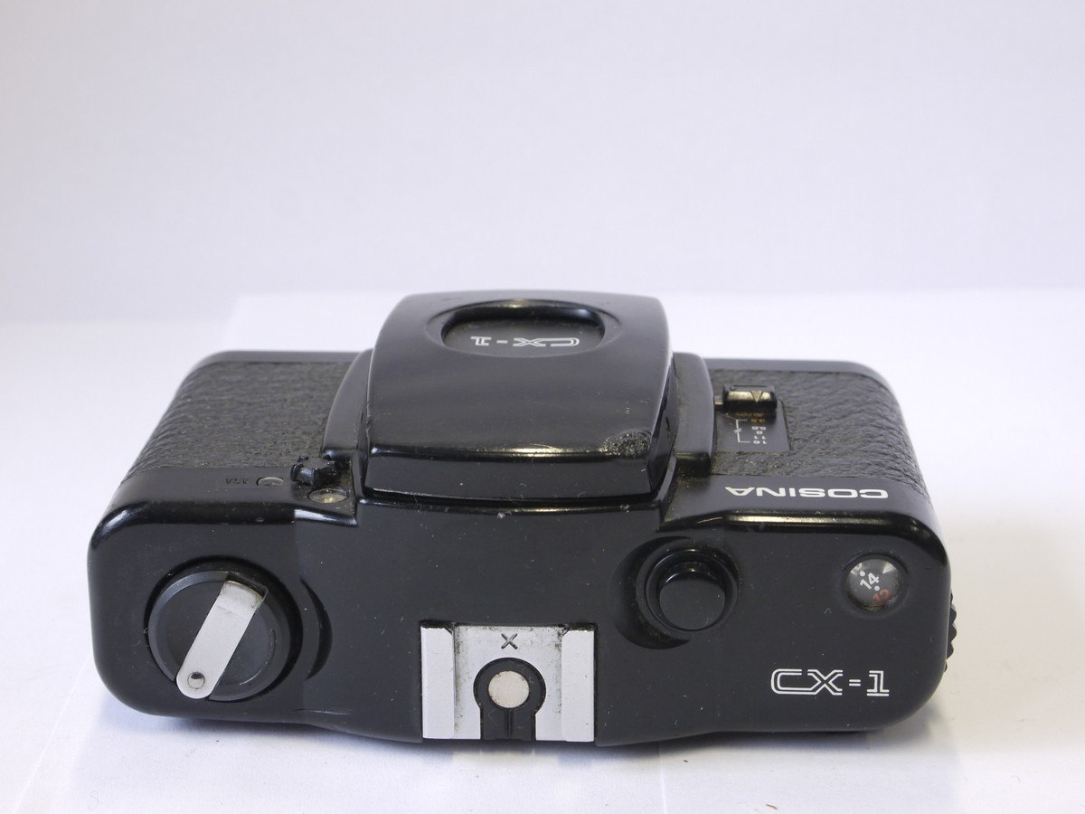 mwclassiccameras-20221007-51 Cosina CX-1 35mm compact zone focus camera with 33mm f3.5 Cosinon lens. Unique trist/lock front cover