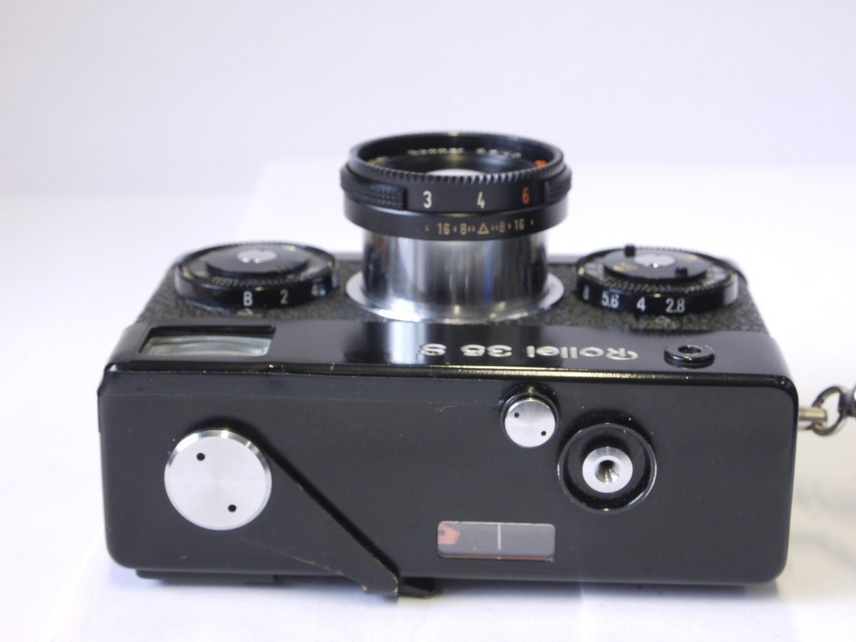 mwclassiccameras-20221007-58 Rollei 35S black CDS metered compact 35mm camera with 40mm f2.8 Sonnar HFT collapsible lens, with makers front cap, wrist strap, instructions & pouch case