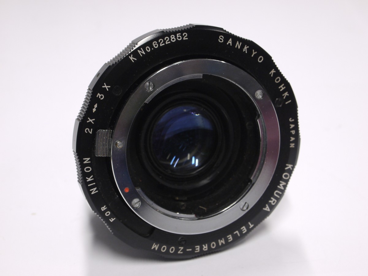 mwclassiccameras-20221111-215 Komura Telemore 7-element teleconverter for Nikon + makers caps. Early type