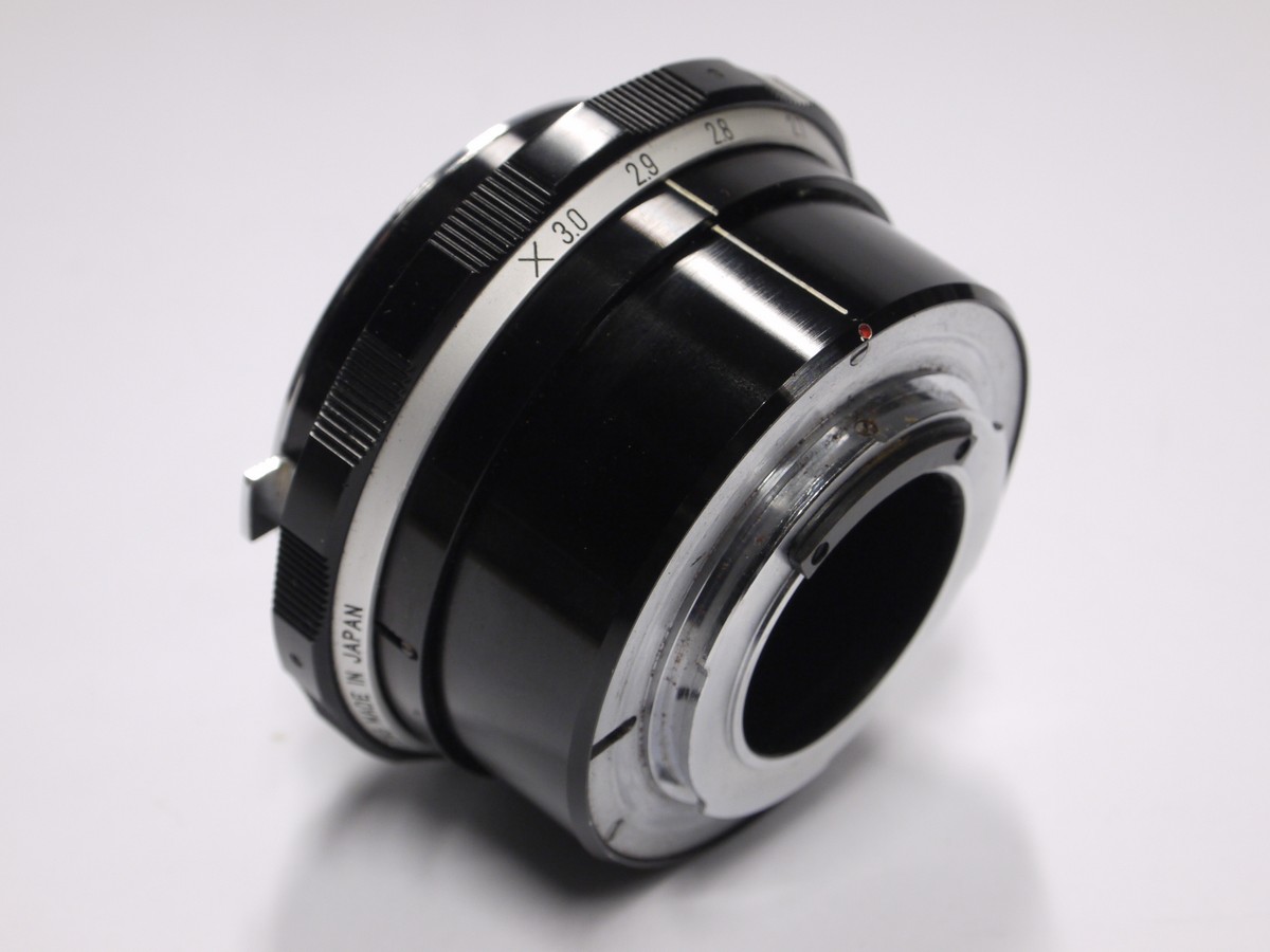 mwclassiccameras-20221111-217 Komura Telemore 7-element teleconverter for Nikon + makers caps. Early type
