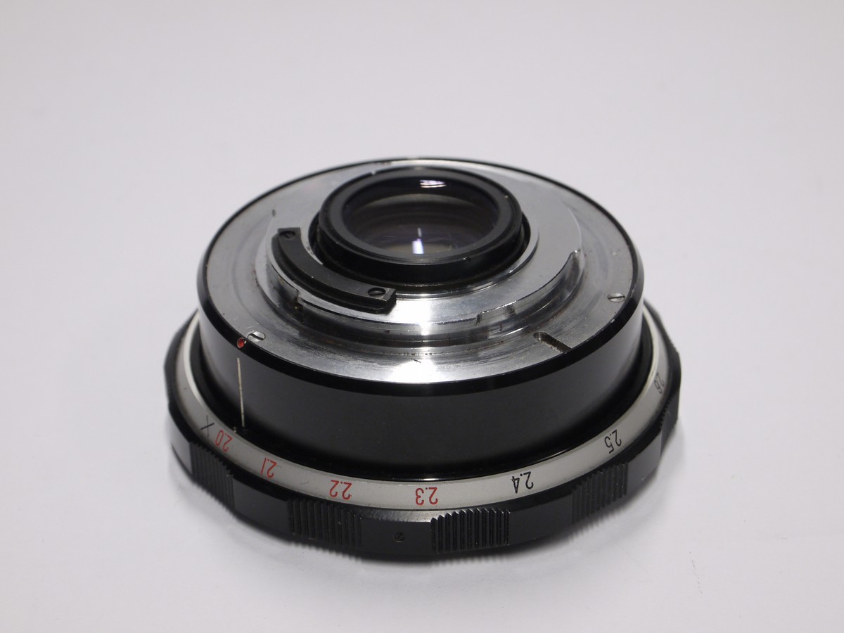 mwclassiccameras-20221111-218 Komura Telemore 7-element teleconverter for Nikon + makers caps. Early type