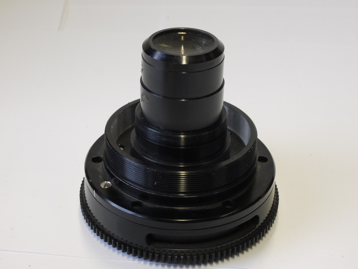 mwclassiccameras-20230106-34 British Cine lens with no mount, no Iris Diaphragm, only a rotating ring. Approximately 50-70mm focal length. Glass diameter is 25mm. Front to rear glass surface is . Possibly a Taylor Hobson Cooke cine lens (has similar styling)