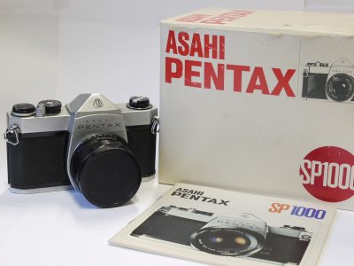 Pentax SP1000 35mm SLR, chrome + 55mm f1.8 Super Takumar M42 lens, front cap, Original Instructions, Original Sales receipt & makers Box with full packaging