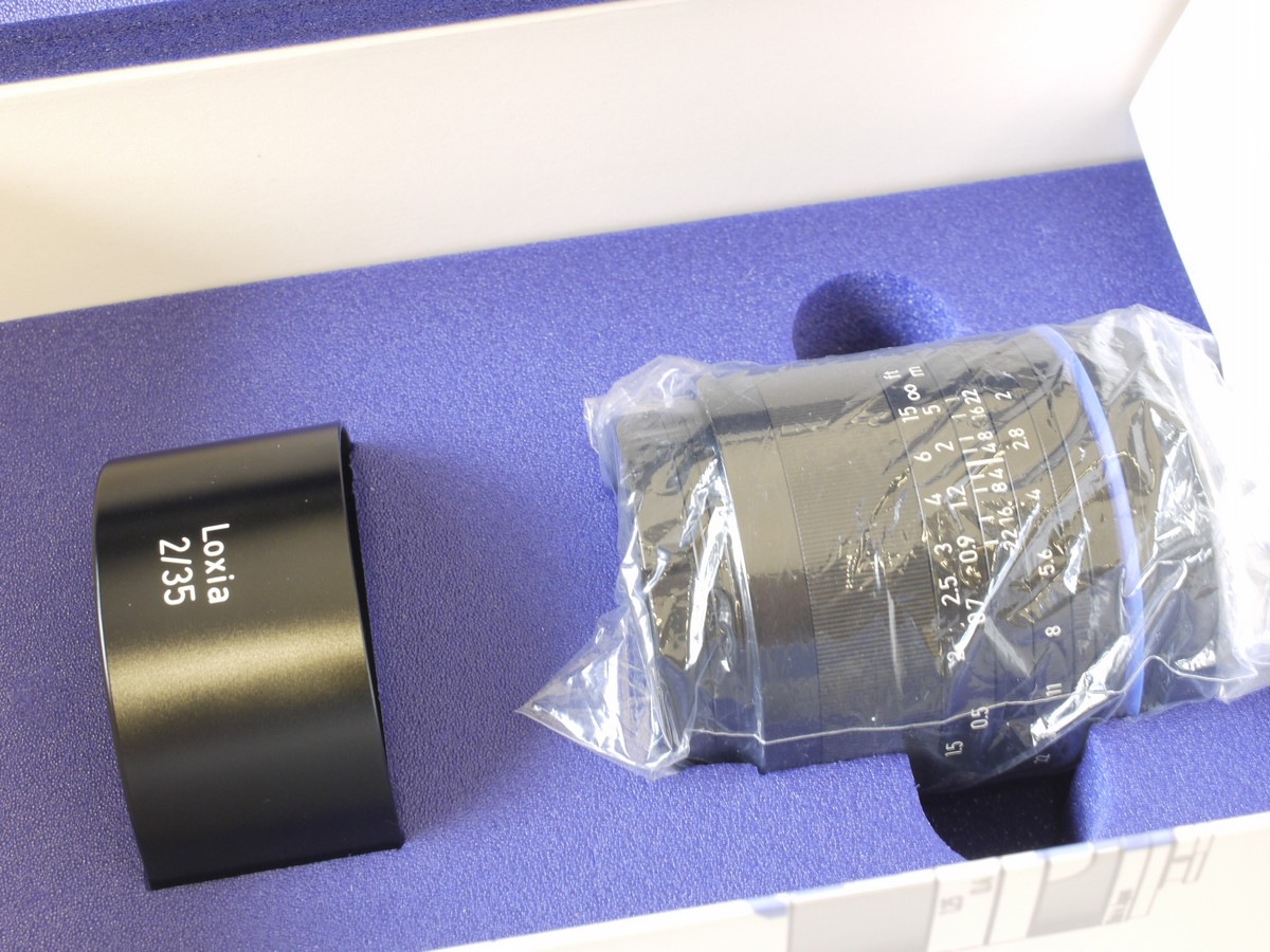 mwclassiccameras-20230203-104 Zeiss Loxia 35mm f2 Sony E mount lens with lens hood, caps, instructions & original matching numbered box with outer sleeve