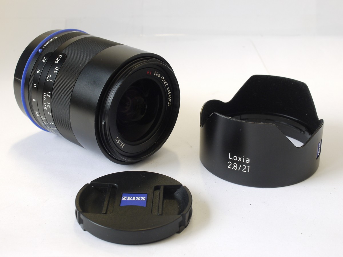 mwclassiccameras-20230203-106 Zeiss Loxia 21mm f2.8 Sony E mount lens with lens hood, caps, instructions & original matching numbered box with outer sleeve