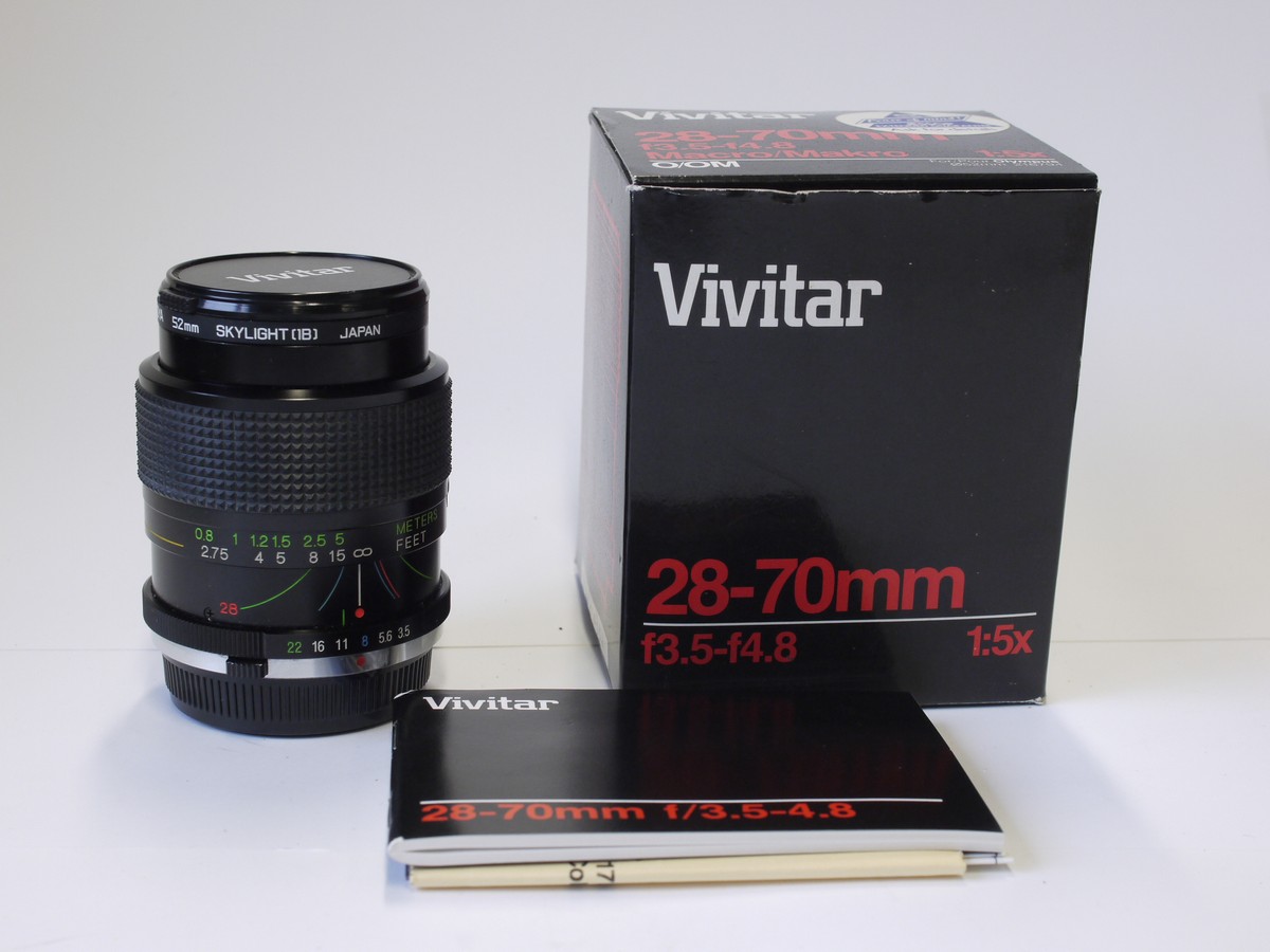 mwclassiccameras-20230217-188 Vivitar 28-70mm f3.5-4.8 lens, Olympus OM mount + Skylight filter, makers caps, instructions & box with packaging