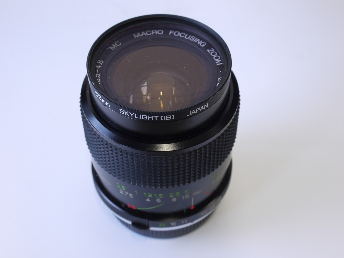 mwclassiccameras-20230217-191 Vivitar 28-70mm f3.5-4.8 lens, Olympus OM mount + Skylight filter, makers caps, instructions & box with packaging